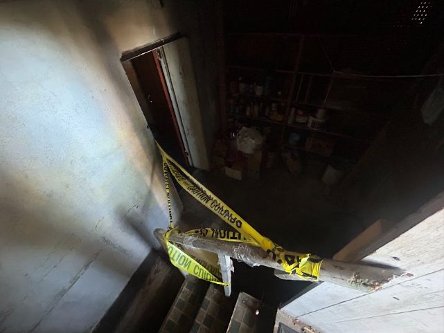 Lower level doorway taped off pending inspection