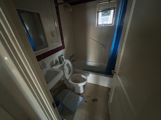 Dated bathroom with original tile