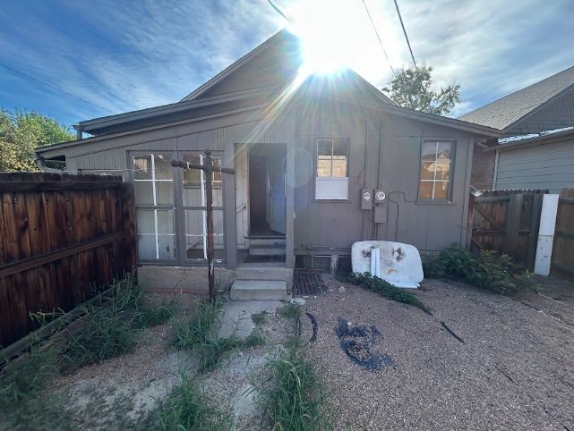Rear yard with alley access and no existing garage