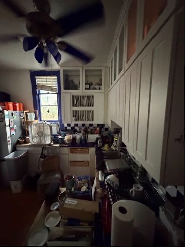Kitchen, dated cabinets and checkerboard tile