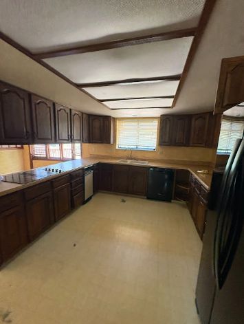 Kitchen, dated wood cabinets